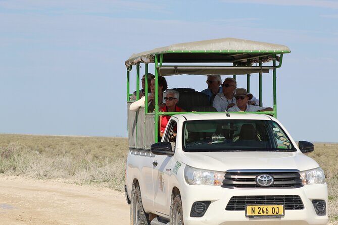 Safari in Etosha national park with professional tour guides born in Etosha. - Etosha Pan and the view from an open vehicle