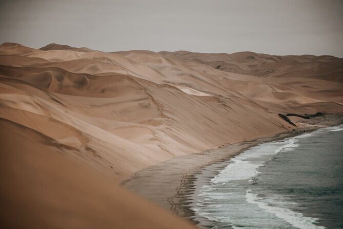 Sandwich Harbour 4x4 Guided Tour - Unforgettable Adventure - Sandwich Harbour: dune-to-ocean views plus the best pause of the day